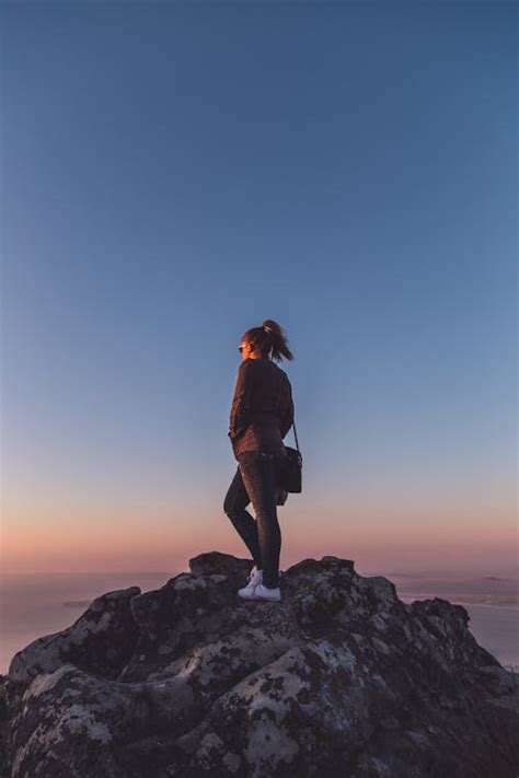 Person Standing On Top Of Mountain · Free Stock Photo