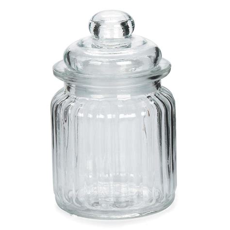 This is a pair of porcelain apothecary cylindrical jars with lids. Darice® Small Glass Canister with Lid: Ribbed, 3 x 4.9375 ...