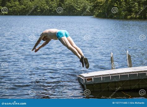 Man Diving Into Lake Stock Image Image Of Lampn Male 157711445