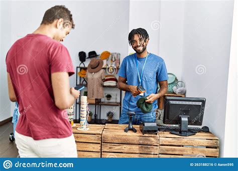 Two Men Shopkeeper And Customer Using Smartphone And Barcode Reader At