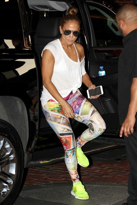 Jennifer Lopez Wears White T Shirt Colorful Graphic Leggings With Neon Green Trainers As She