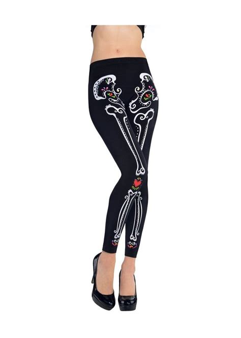 A Woman Wearing Black And White Skeleton Leggings With Skulls On The Side