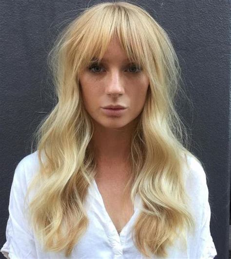 Flared layers and sweeping bangs on golden blonde hair. 40 Long Hairstyles and Haircuts for Fine Hair with an ...