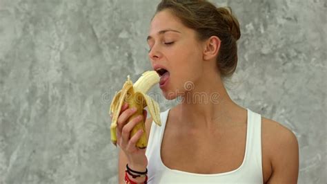 Attractive Woman Peeling And Eating A Big Banana Stock Video Video Of Hold Hair 116710481