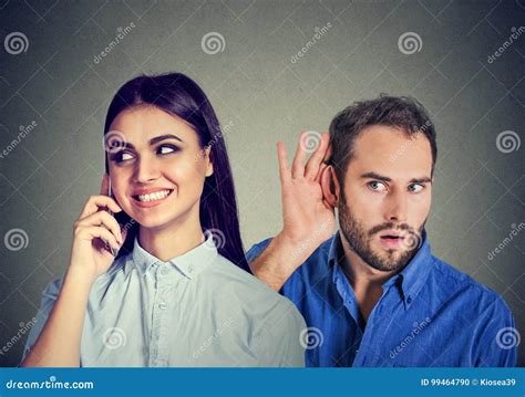 A Cheating Girlfriend Curious Man Secretly Listening To A Happy Woman Talking On Mobile Phone