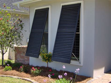 In case you decide to build your own hurricane shutters, here are a few things to be kept in mind. Close-up view of a pair of black bahama-style hurricane shutters. | Outdoor shutters, Shutters ...