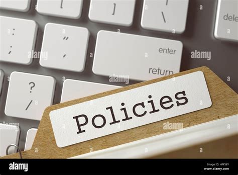 Policies Written On Folder Register On Background Of Computer Keyboard