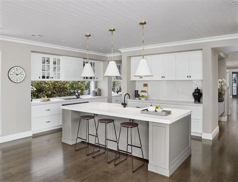 The bare floor, metal stools, and plain cabinets all work to highlight the chic minimalist theme. Hamptons Kitchen Design Ideas: Top 10 for 2021 - TLC Interiors