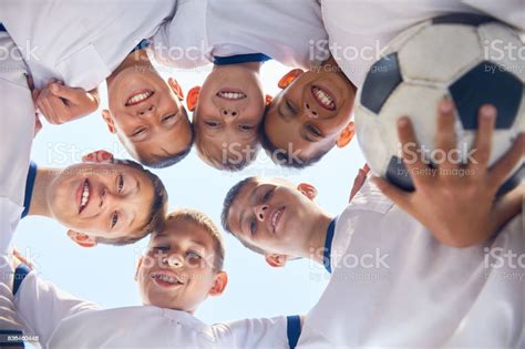 Junior Football Team Huddling Stock Photo Download Image Now Soccer