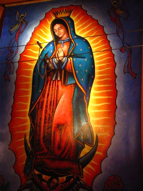 [image is a painting of mary kneeling in prayer with a golden rayed sun and roses behind her. Our Lady of Guadalupe | rick | Flickr