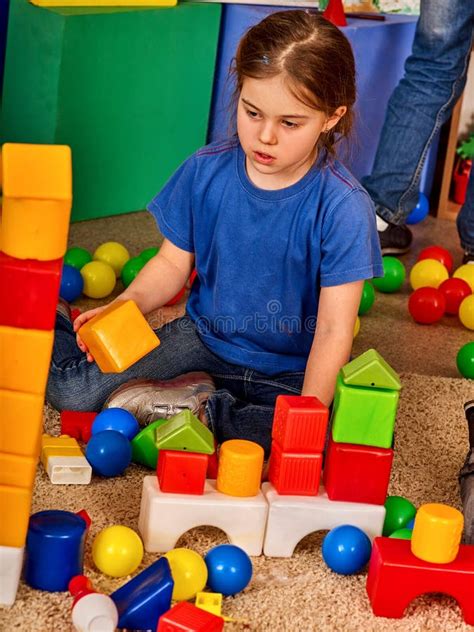 Children Building Blocks In Kindergarten Group Kids Playing Toy Floor