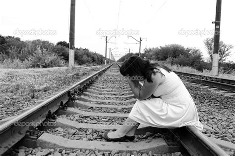 Pensive Sad Woman Sitting On Railroad Tracks — Stock Photo