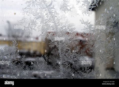 Frosted Frozen Ice Crystals On A City Window In Icy London Winter