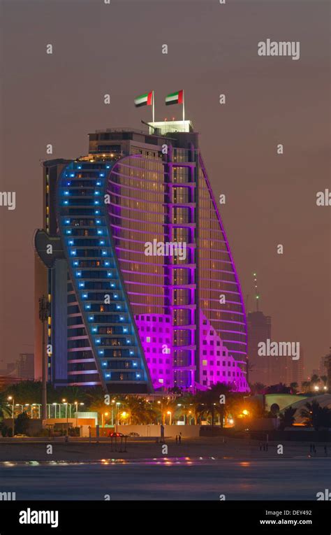 The Illuminated Jumeirah Beach Hotel On Jumeirah Beach At Dusk Emirate