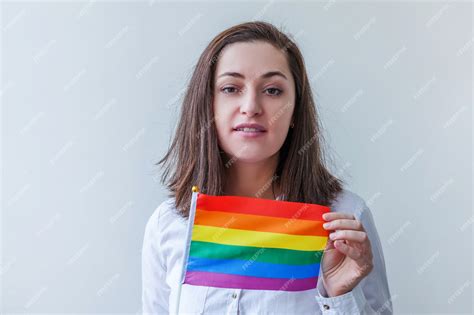 premium photo beautiful caucasian lesbian girl with lgbt rainbow flag isolated on white