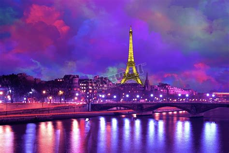 Eiffel Tower At Night Against A Dramatic Sky Pickawall
