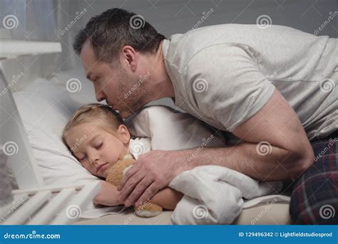 Father Kissing Cute Little Daughter Sleeping Royalty Free Stock Image 129496342