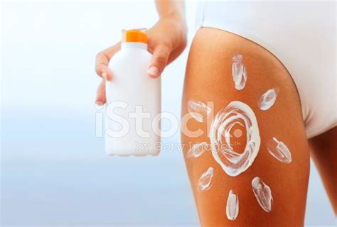 Woman Putting Sunscreen Lotion On Her Body Stock Photo Royalty Free Freeimages
