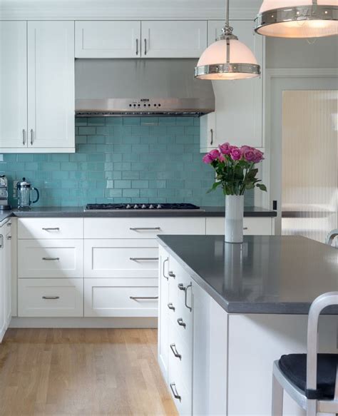 Perhaps you're trying to consider the it is very important to remember that in your kitchen design, all things should be functional. Kitchen with white cabinets, gray countertops, turquoise ...