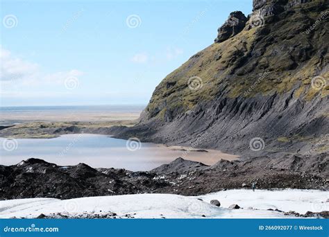Scenic View Of A Barren Mountain Slope Against The Sea Stock Image
