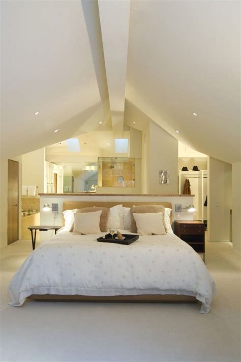 An Open Concept Attic Space Houses A Bedroom Closet And Bathroom The