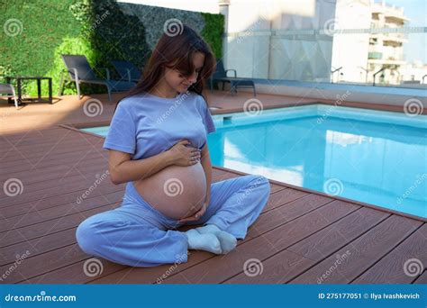 Pregnant Girl Near Pool Holding Her Stomach Close Up Stock Image Image Of Health Hand