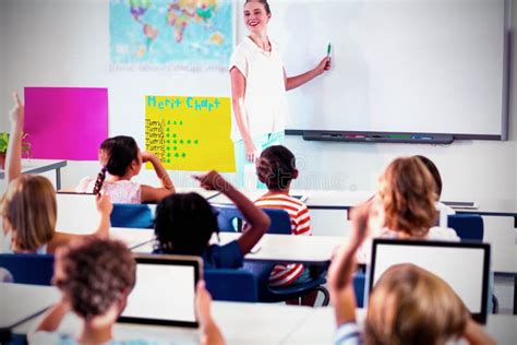 Teacher Teaching Students Using Whiteboard Stock Image Image Of Girls