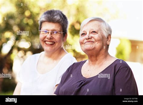 Older Women Smiling Together Outdoors Stock Photo Alamy