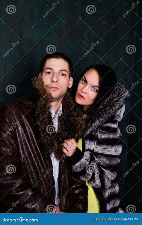 Young Attractive Couple Handsome Man And Woman In Fur Coat Stock Photo