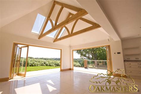 In many cases, a vaulted ceiling makes the room feel more open, bringing air and light into a room. These custom designed oak trusses create a great ...
