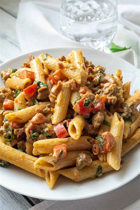 creamy italian sausage and tomato pasta foodtasia