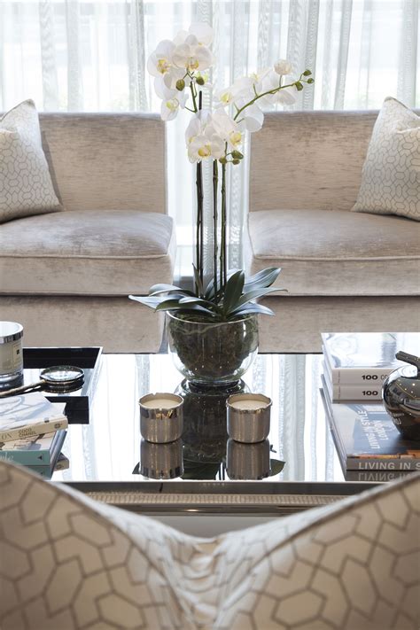The antique crock pot filled with flowers is just the right size. Coffee table accessories -Designed by JHR Interiors ...