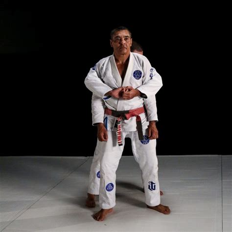 Rickson Gracie — A Defense To An Over The Arm Rear Attack Graciemag