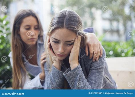Woman Comforting To A Sad Depressed Friend Who Needs Help Stock Image