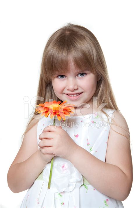 Smiling Little Girl Holding A Flower Stock Photo Royalty Free