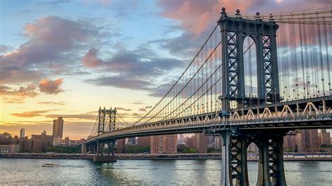 Manhattan Bridge Over East River At Sunset New York City Usa