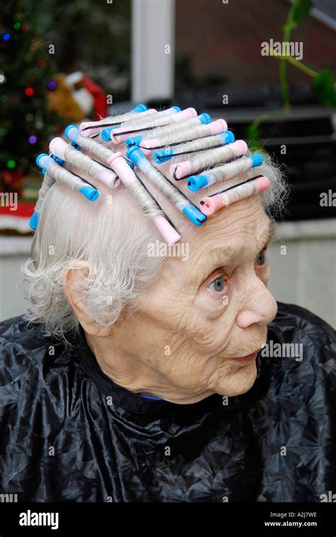 Senior Elderly Woman Has Hair Cut Shampoo Color And Permanent Done By A