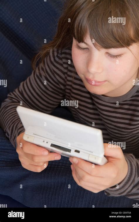 Young Girl Playing Nintendo Ds Game Stock Photo Alamy