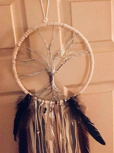 A White Dream Catcher Hanging On The Wall