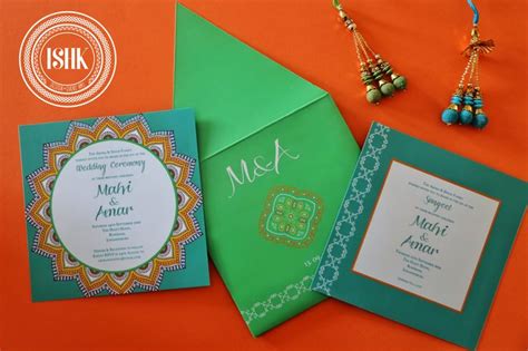 The Wedding Stationery Is Displayed On An Orange Background With Other