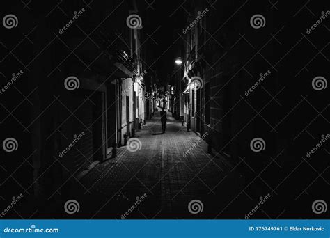 Woman Walking Alone In The Street Late At Nightnarrow Dark Alley