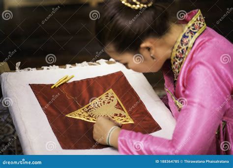 Traditional Isan Thai Silk Weaving Asian Woman Embroidering Golden Thread On Silk Stock Image