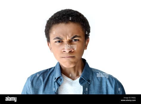 Portrait Of Angry African American Teen Boy Looking At Camera Isolated