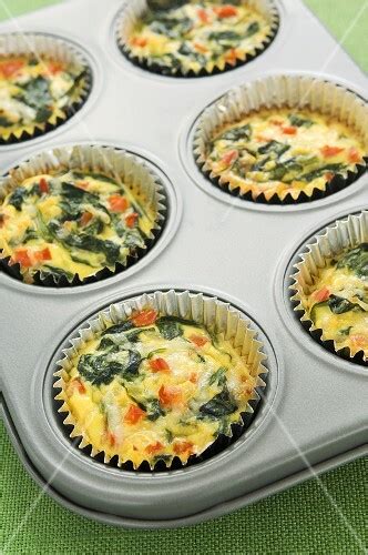 Mini Spinach Quiches In Muffin Cups In Muffin Pan Buy Images Stockfood