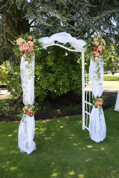 Create A Picture Perfect Backdrop For An Outdoor Wedding With An Arch