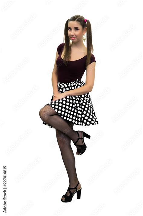 Young Pin Up Girl In Polka Dot Dress Black Stockings And In High Heels