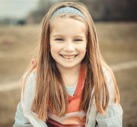 happy liitle girl sitting at the table stock image image of cropped elementary 178546517