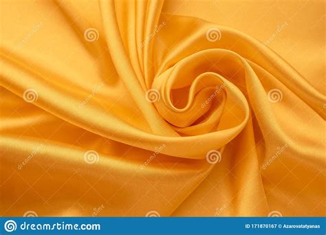 Silk Background Folds Of Yellow Satin Smooth Shiny Fabric Texture Abstract Bright Wallpaper