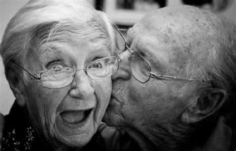 An Older Couple Kissing Each Other In Black And White With The Caption That Reads I Love You So