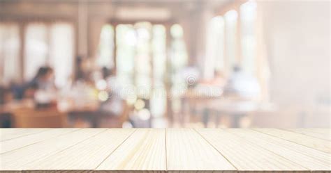 Wood Table Top With Restaurant Cafe Interior Blur Background Stock